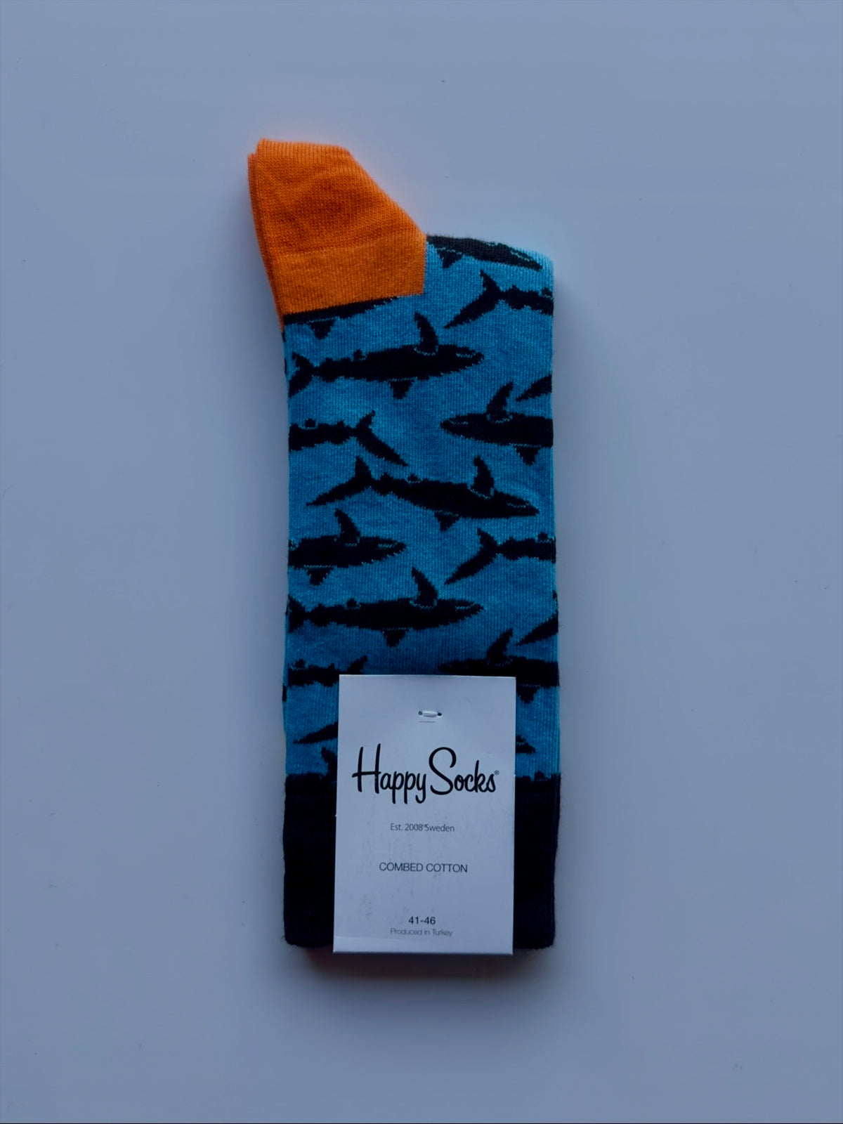 Men's Happy Sock Combed Cotton From Fireqasi  Blue sock with shark pattern and orange cuff 